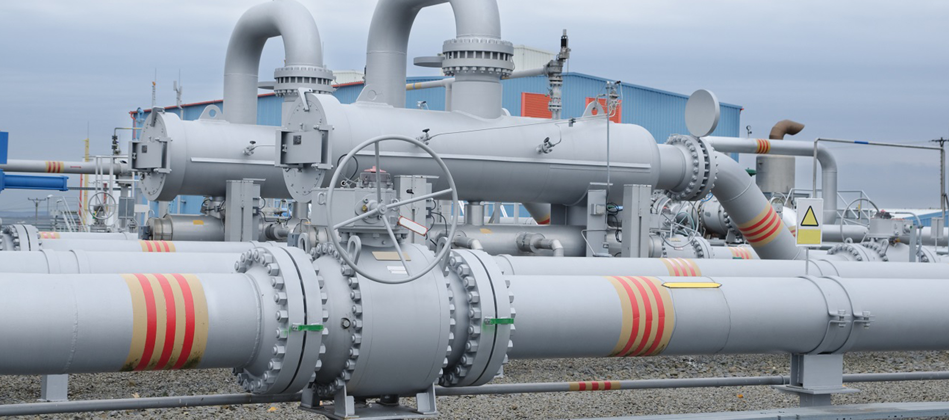 Grey colored globe valve installed in industrial unit outdoor by Indonesia's top globe valve manufacturer & supplier