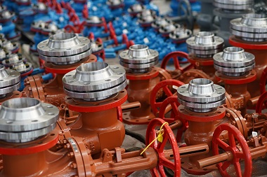 Series of neatly arranged red gate valves by the gate valve manufacturer